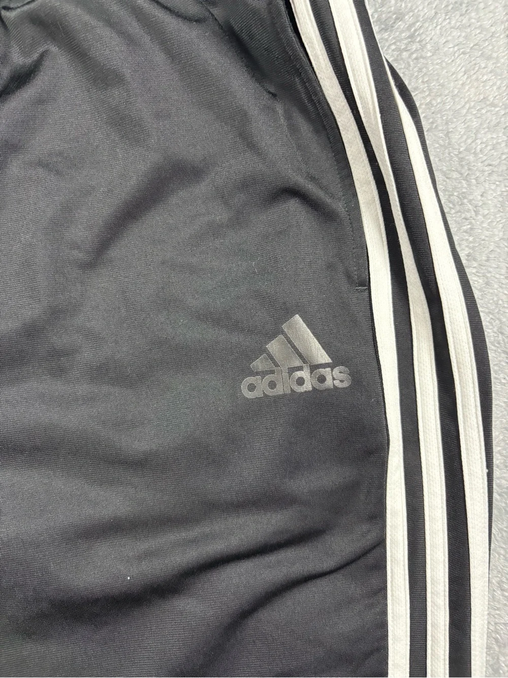 Adidas black track pants with white stripes